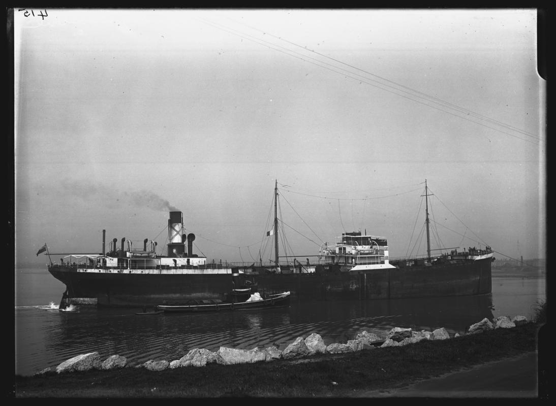 3/4 starboard stern view of S.S. CYMBELINE and tug, c.1936.