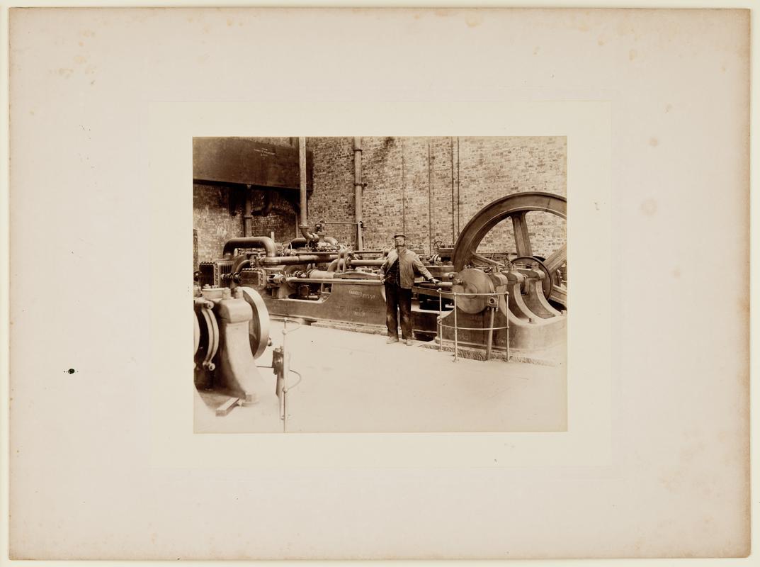 The interior of the pump house showing the installation of the Tannett Walker &amp; Co. steam pumping engine during the construction of Barry No. 1 Dock. Mounted on card.