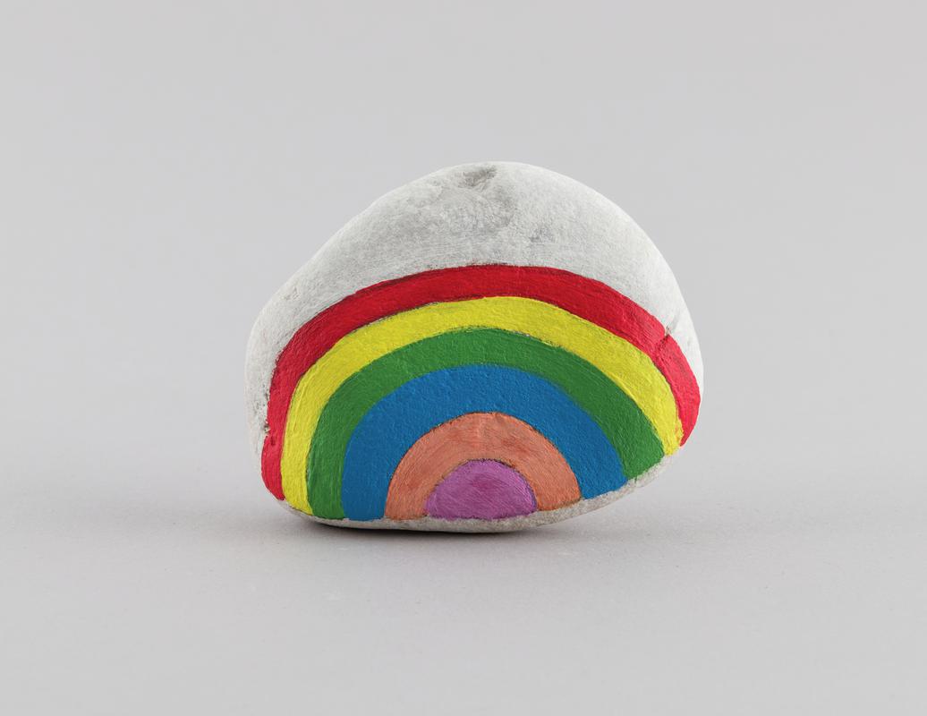 Painted pebble / stone with a rainbow on