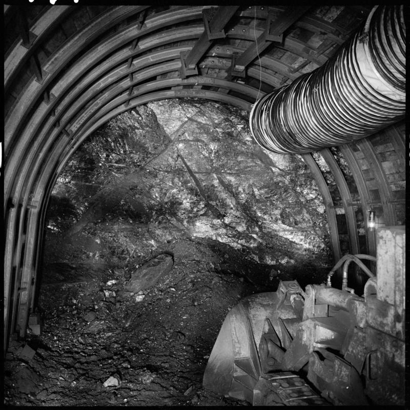 Black and white film negative showing an Eimco machine in a development heading, possibly in the Nine Feet seam, Blaengwrach Mine, 1 November 1979.  &#039;Blaengwrach 1 Nov 1979&#039; is transcribed from original negative bag.  Appears to be identical to 2009.3/1336