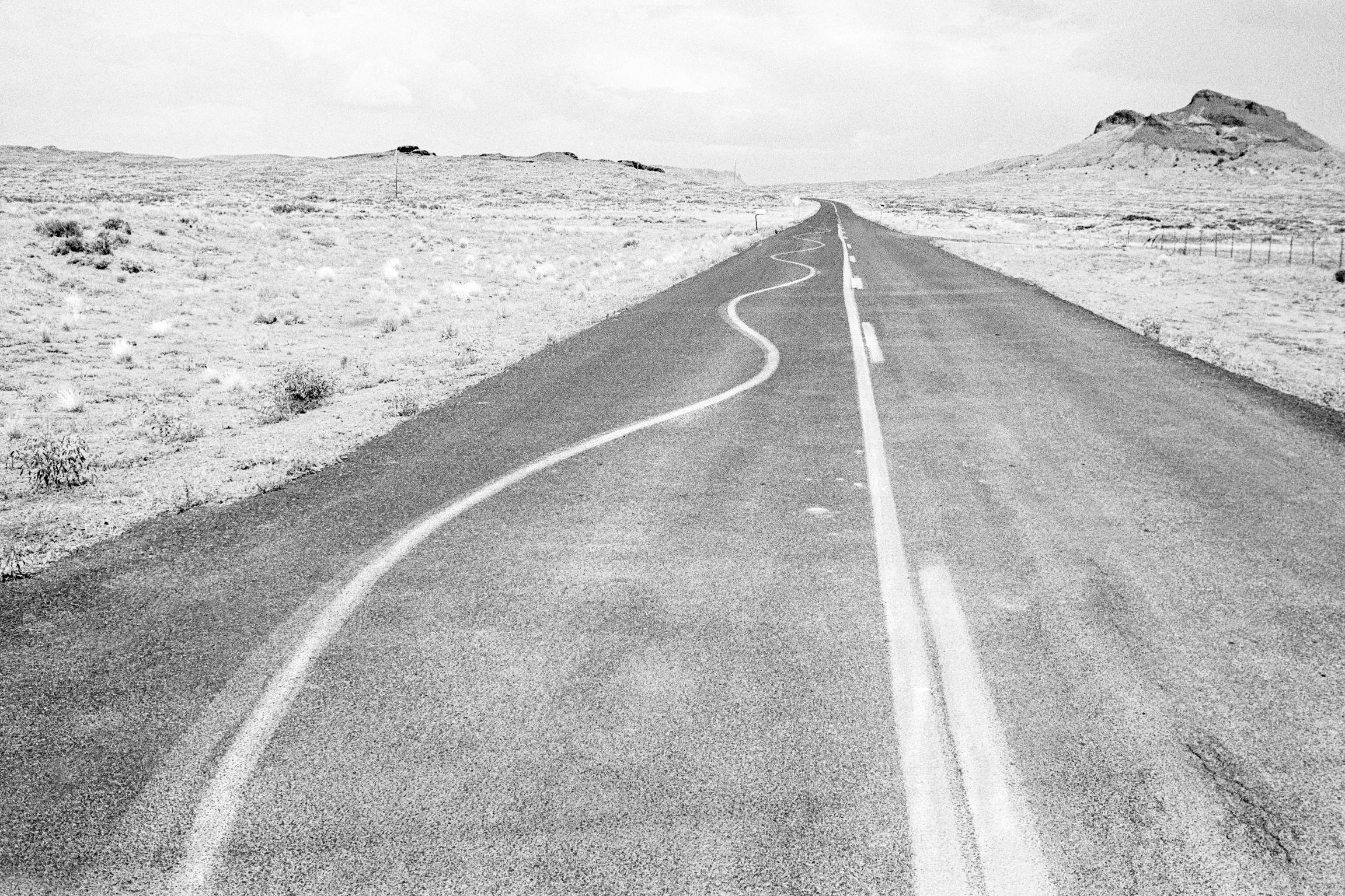 The main highway through the Painted Desert seems to have rather surreal road markings. Arizona USA