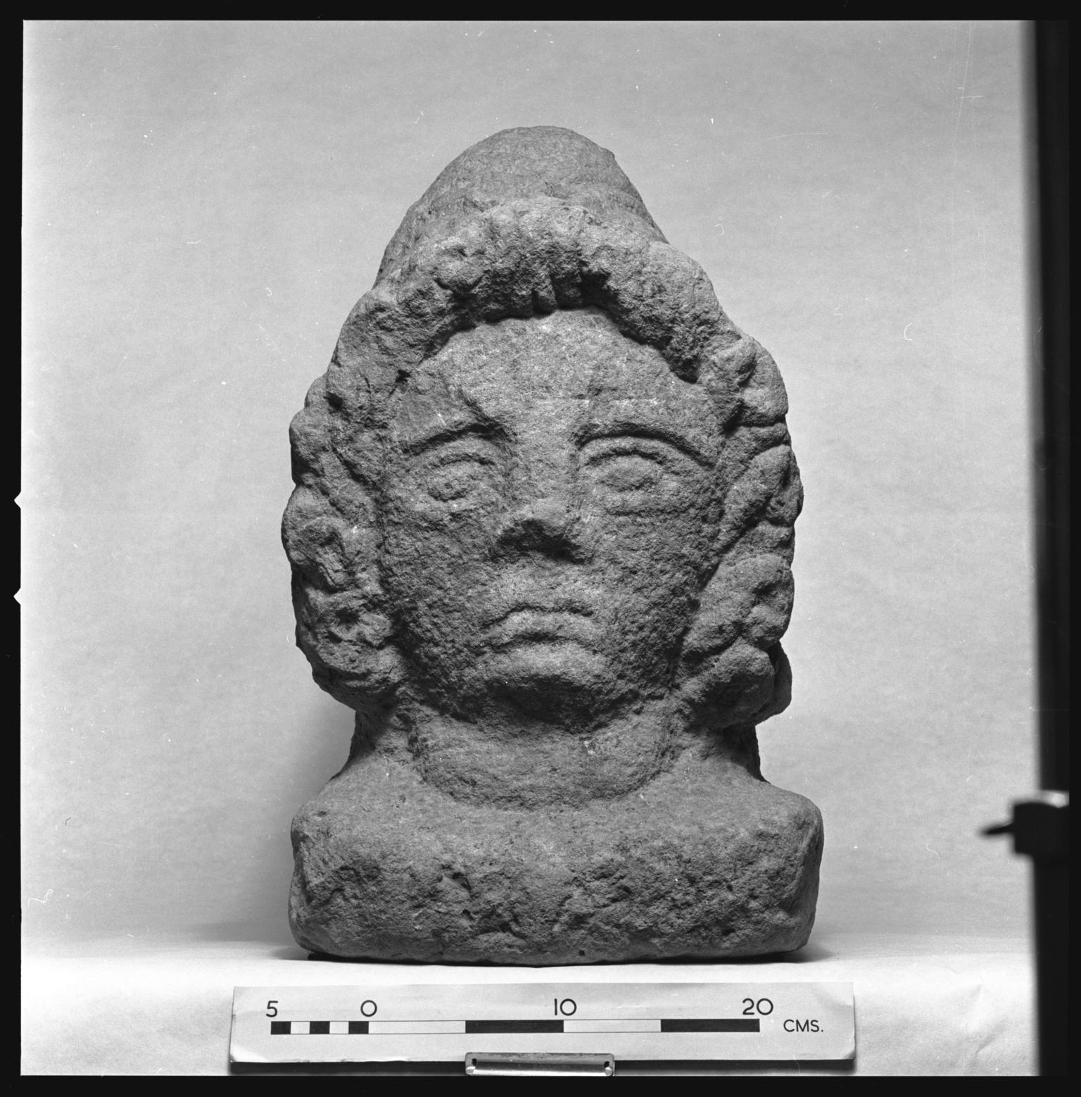 Roman stone funerary head of Attis