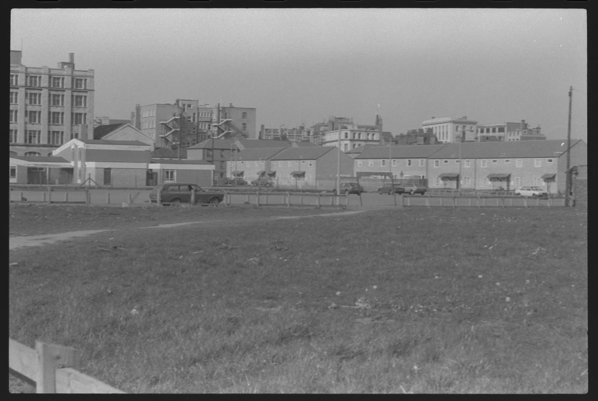 View across open ground behind Bute Esplanade, looking towards James Street.