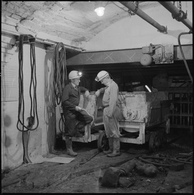Black and white film negative showing two miners at pit bottom, Big Pit Colliery.  &#039;Big Pit Blaenavon&#039; is transcribed from original negative bag.