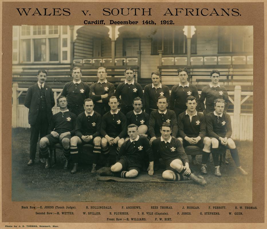 Photograph &#039;Wales v South Africans Cardiff, December 14th 1912&#039; of Welsh rugby team with names printed below. Mounted on card.