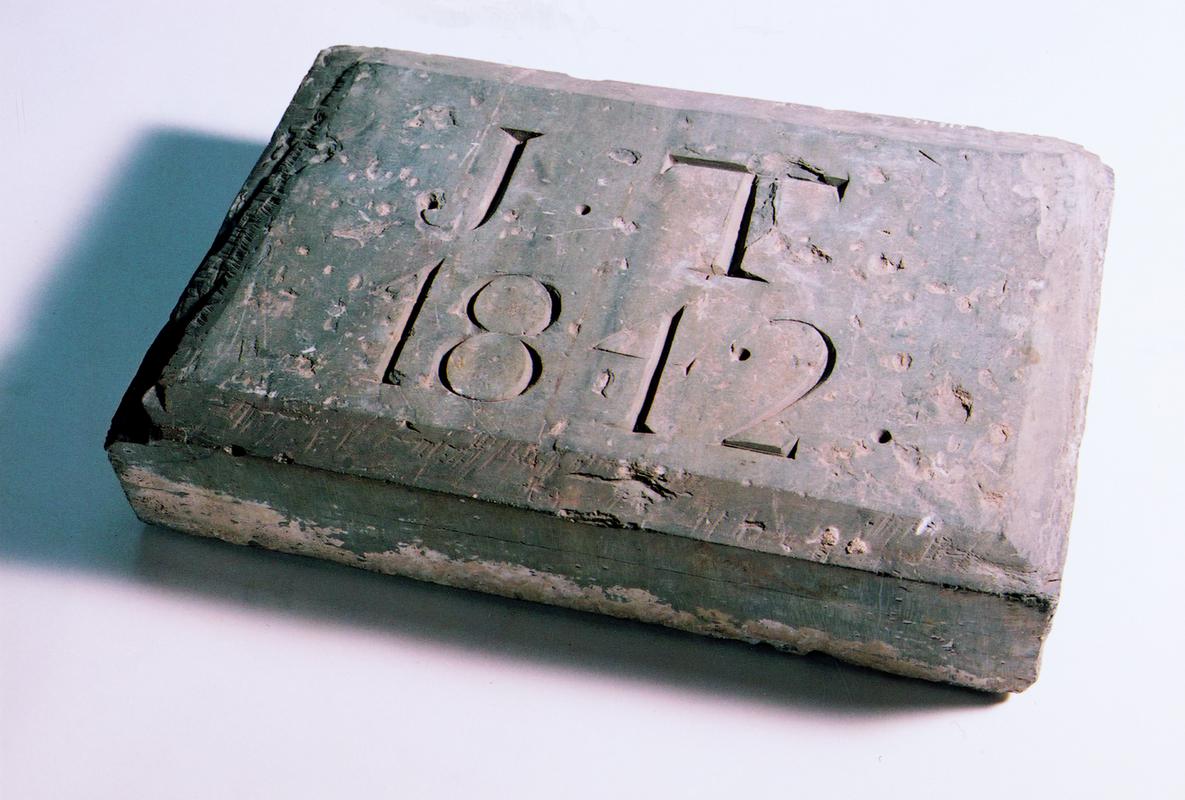 Stone plaque, &quot;J.T 1842&quot;. Recovered from incline shaft at Gogine Lead Mines.