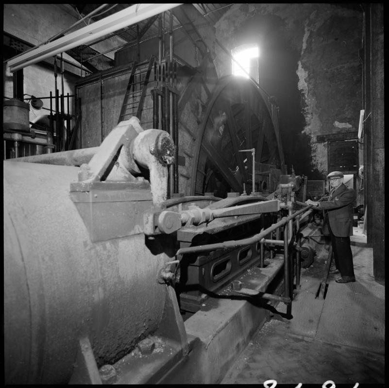 Black and white film negative showing George Watkins in the engine house, Elliot Colliery.  &#039;East Elliot&#039; is transcribed from original negative bag.