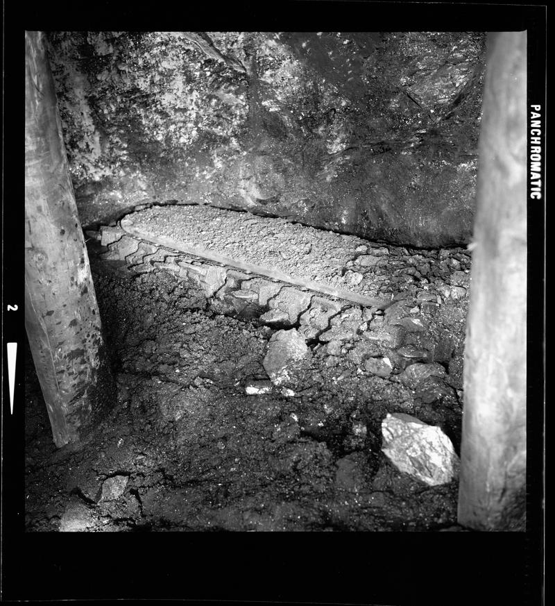 The jib of an AB 15 hydraulic undercutter on a timbered longwall face, Fernhill Colliery, film negative
