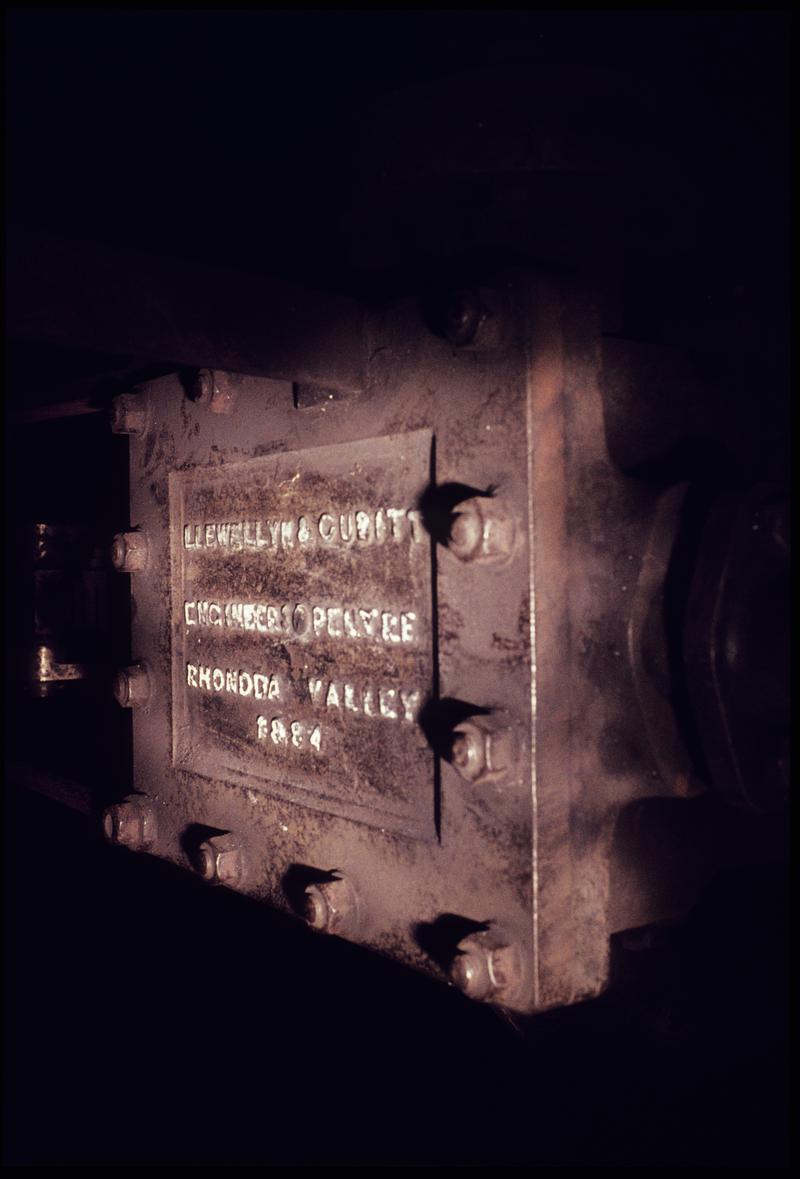 Colour film slide showing the cylinder cover of the Llewellyn &amp; Cubit haulage engine, Western Colliery, July 1976