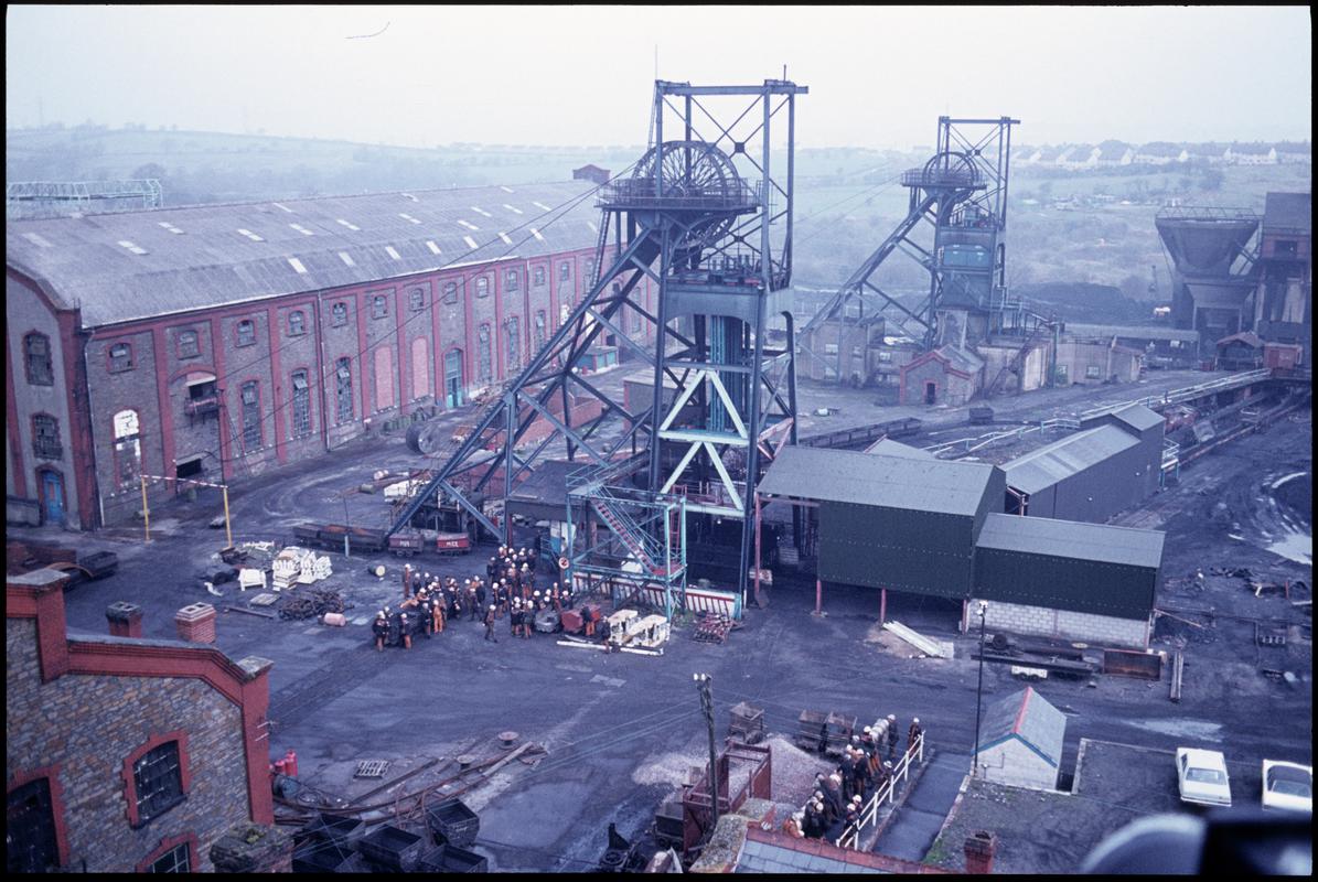 Colour film slide showing a general view of Penallta Colliery from the baths, with the afternoon shift waiting to descend, April 1981.