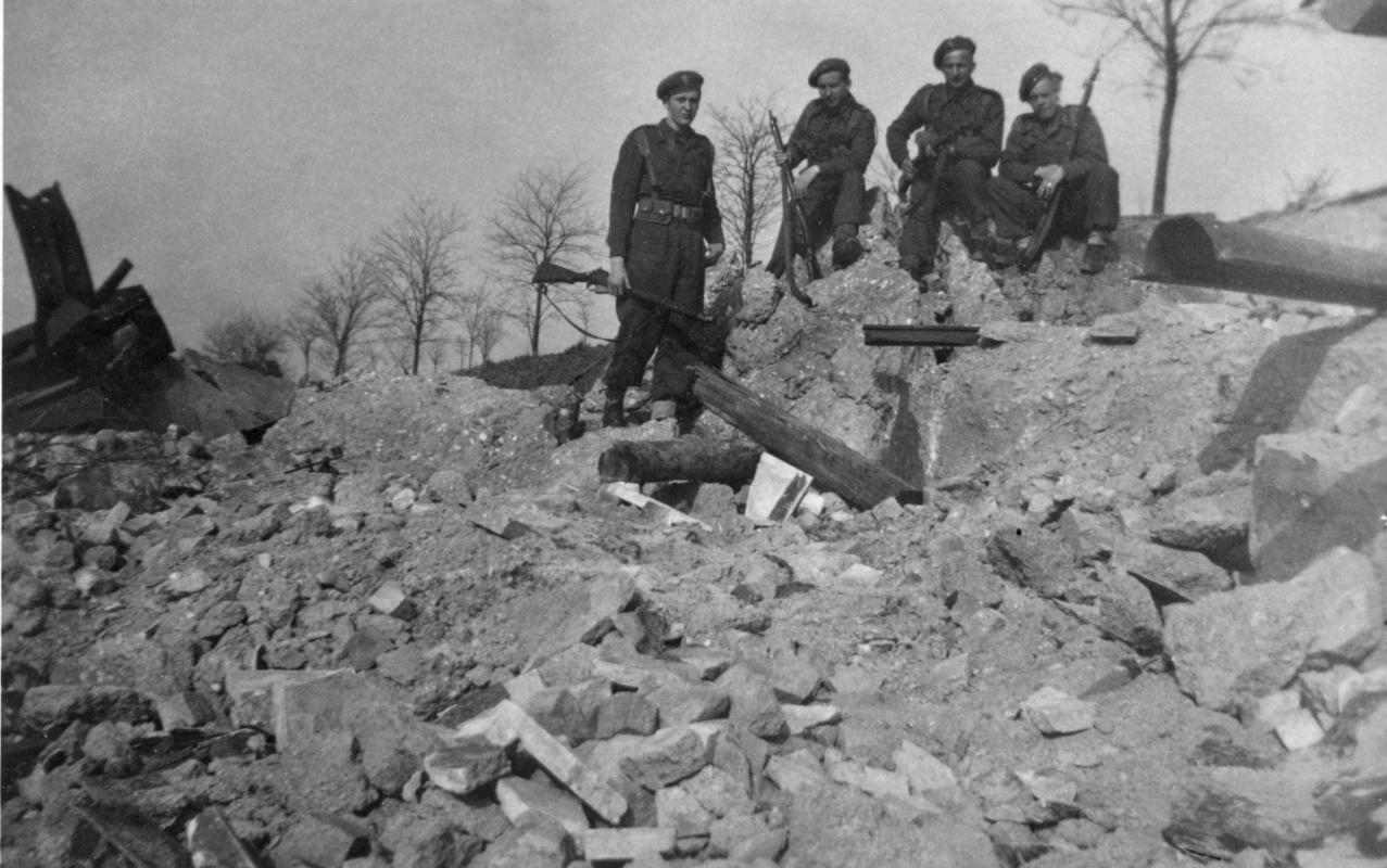 Polish soldiers in destroyed village