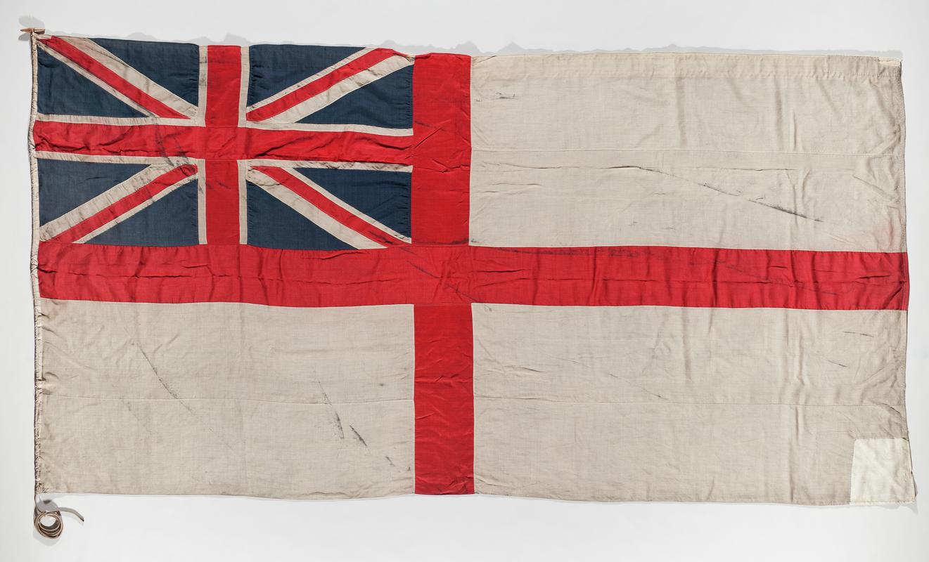 Ensign flag consists of the flag of St George (red cross on white ground) with the Union Jack flag fitted into the upper left quarter. Flown on the Terra Nova during Captain Robert Falcon Scott&#039;s exoedutuion to the South Pole, 1910 - 1913.