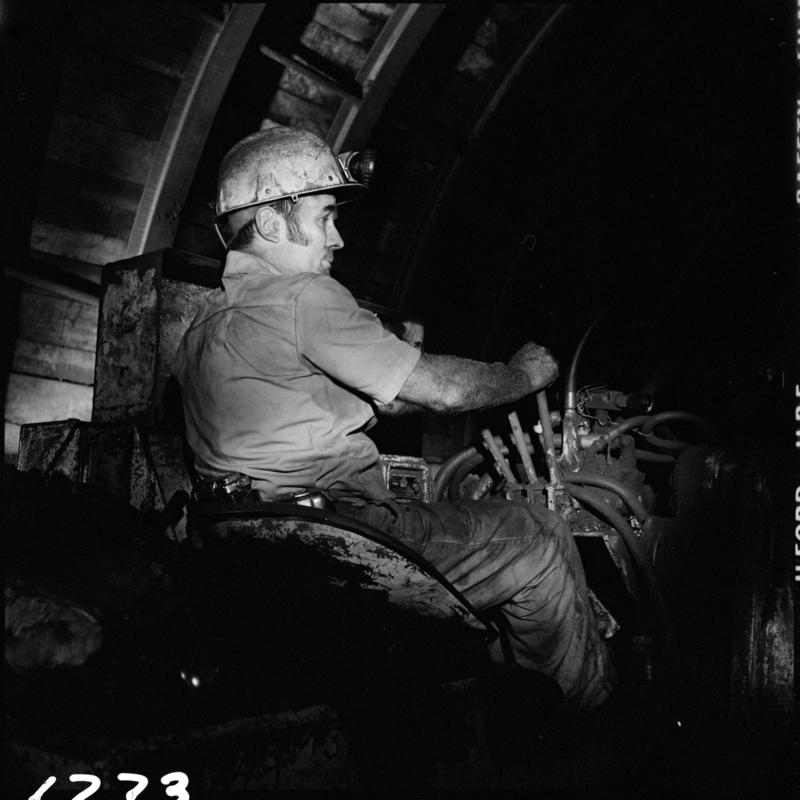 Black and white film negative showing a man operating an Eimco machine,  Blaengwrach Mine, 1 November 1979.  &#039;Blaengwrach 1 Nov 1979&#039; is transcribed from original negative bag.