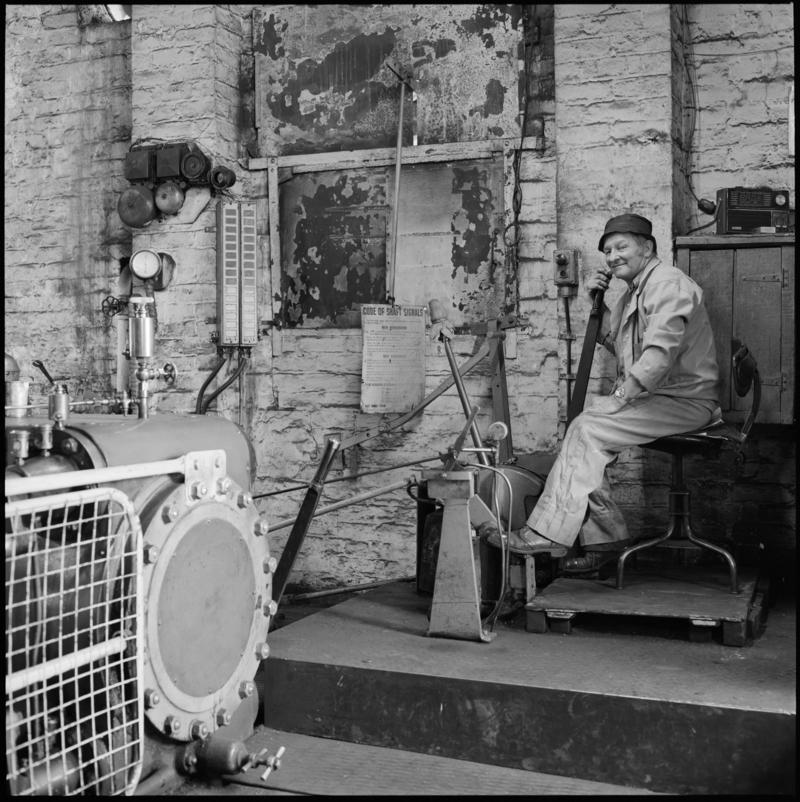 Black and white film negative showing a man operating the Andrew Barclay steam winder, Morlais Colliery 13 May 1981.  &#039;Morlais 13/5/81&#039; is transcribed from original negative bag.