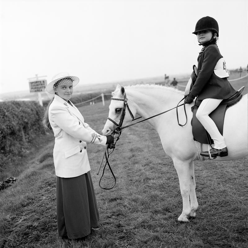 GB. WALES. Cardiff. Anglesey show. Sian Jones, horse handler and 7 year old rider Kelsie Beattie. 1997.