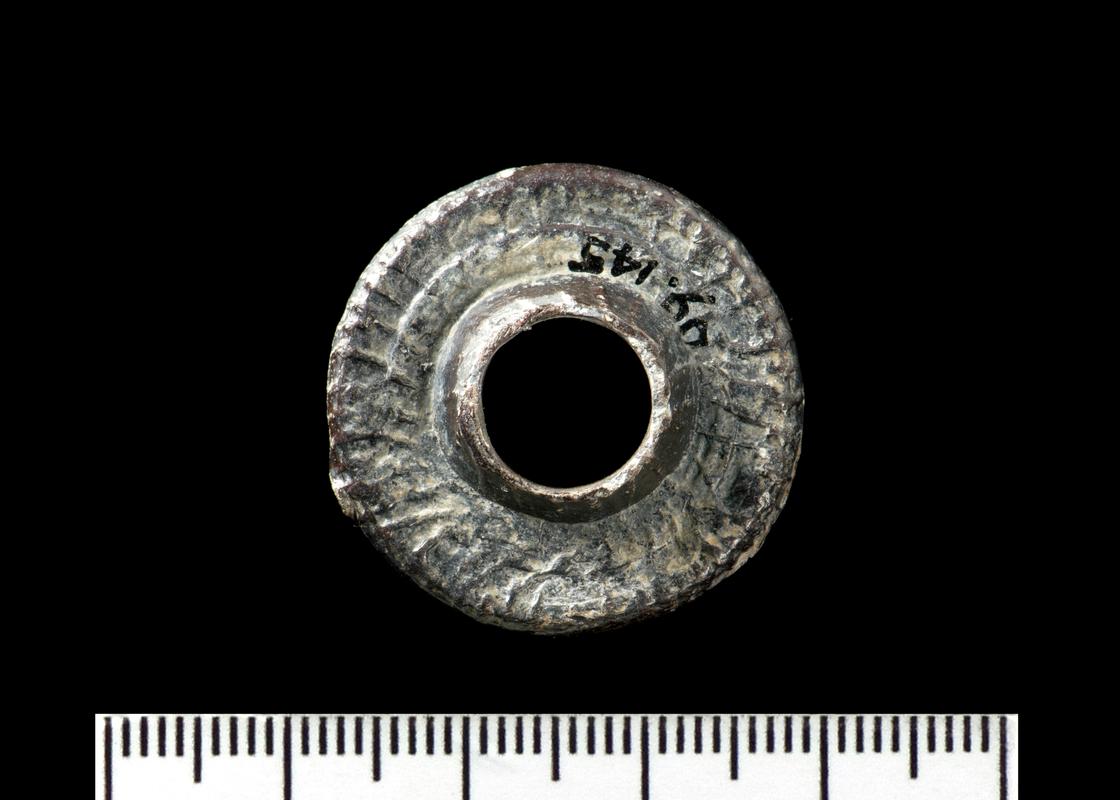 Medieval lead spindlewhorl (Obv)