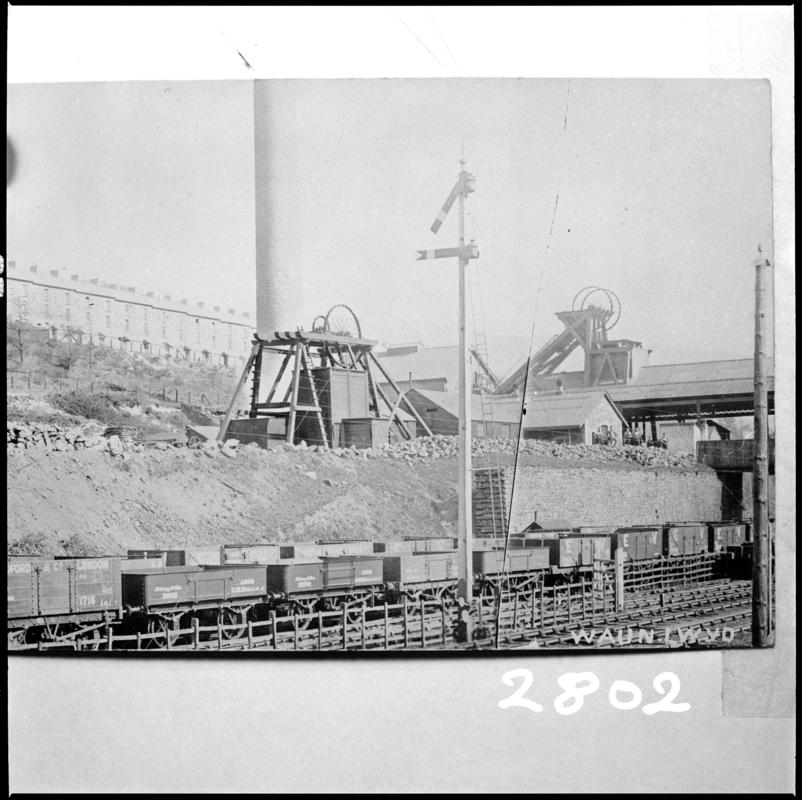 Black and white film negative of a photograph showing a surface view of Waunlwyd Colliery c.1900.  &#039;Waunlwyd&#039; is transcribed from original negative bag.