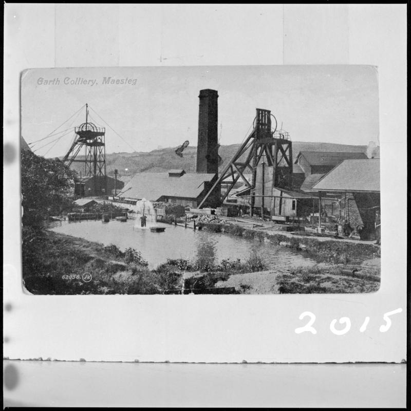 Black and white film negative of a postcard showing a general surface view of Garth Colliery, Maesteg. &#039;Garth Colliery&#039; is transcribed from original negative bag.