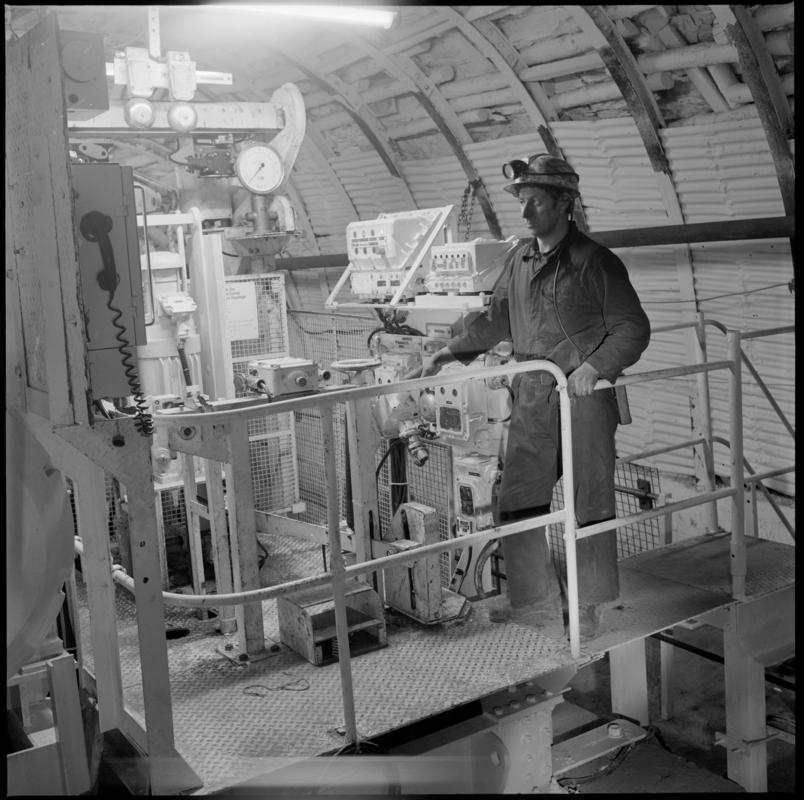 Colour film negative showing a man operating the haulage engine underground at Cwmtillery Colliery.  &#039;Cwmtillery&#039; is transcribed from original negative bag.