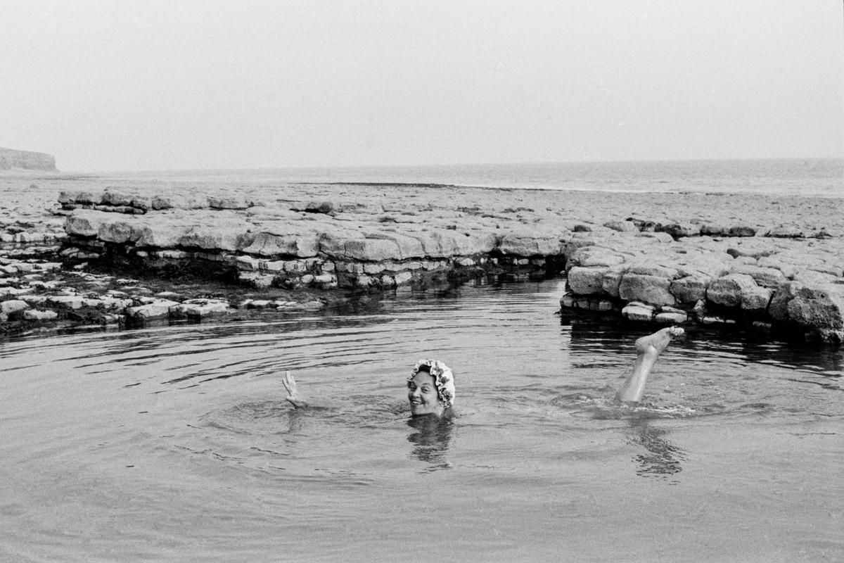 GB. WALES. Llantwit Major. Joyce (my sister) in a rock pool. 1971