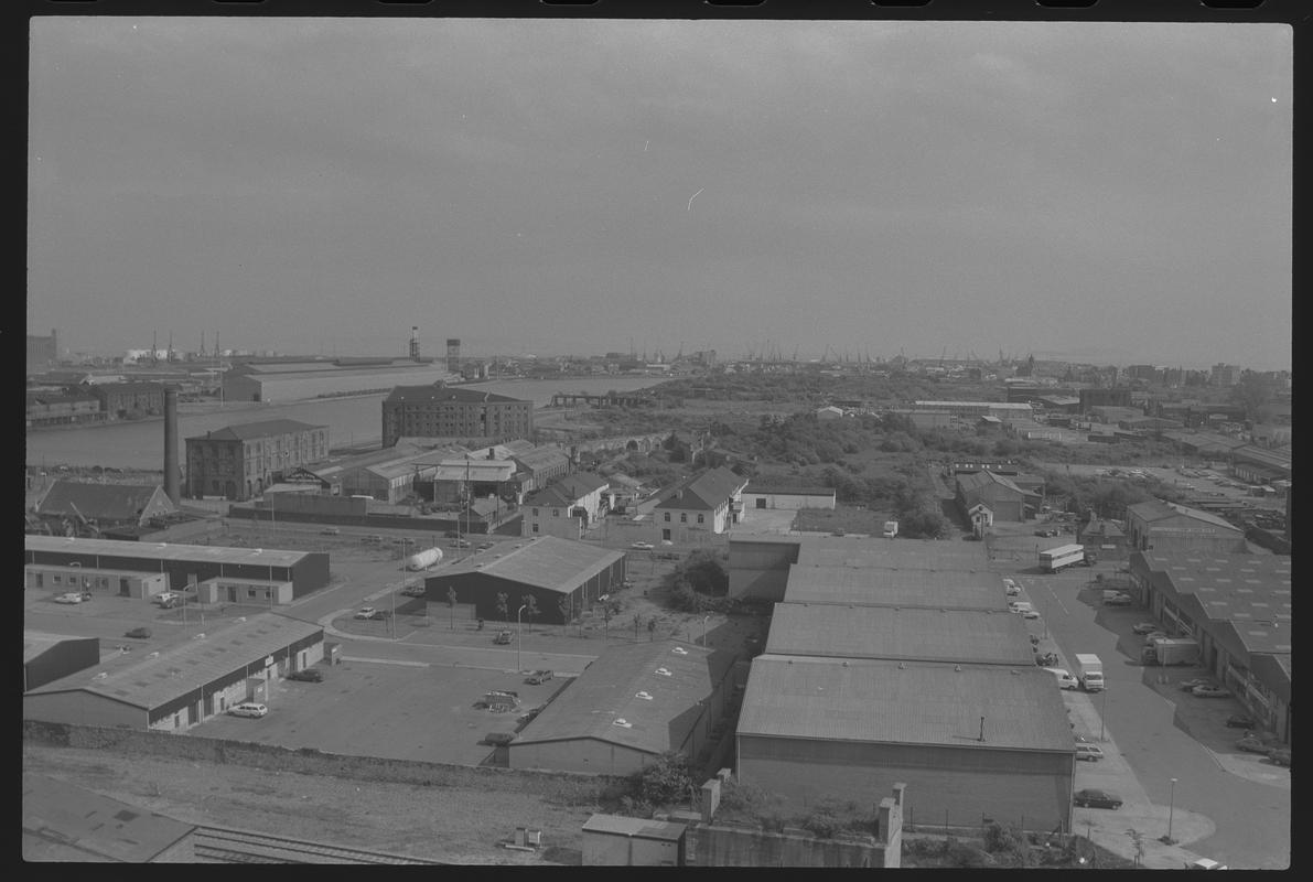 View to south east Butetown with Tyndall Street Industrial Area in foreground, with East Dock, Spillers Building and Pier Head Building in background.