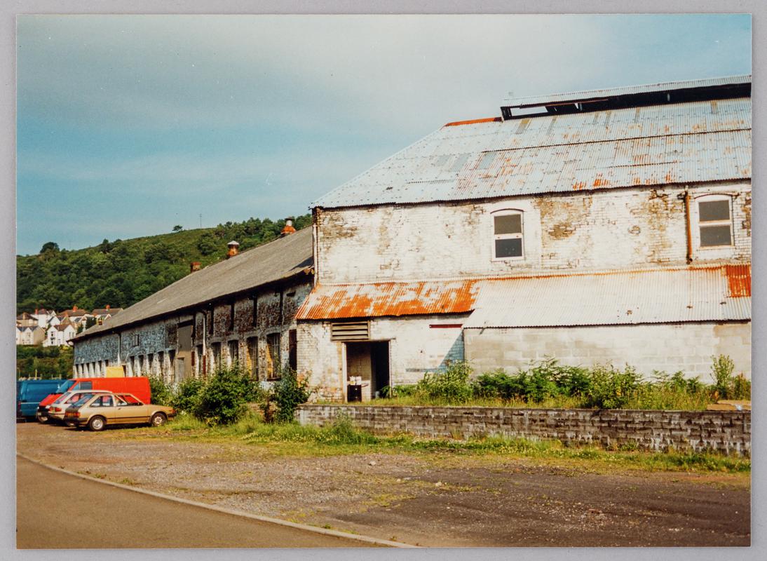 Looking south west at Pontardawe Tinplate Works, Pontardawe showing south end of tinhouse (right) and assorting room south façade (left), October 1994.