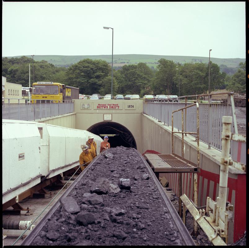 Colour film negative showing the entrance to the mine with man riding cars and conveyor, Betws Mine 10 June 1982.  &#039;10 Jun 1982&#039; is transcribed from original negative bag.