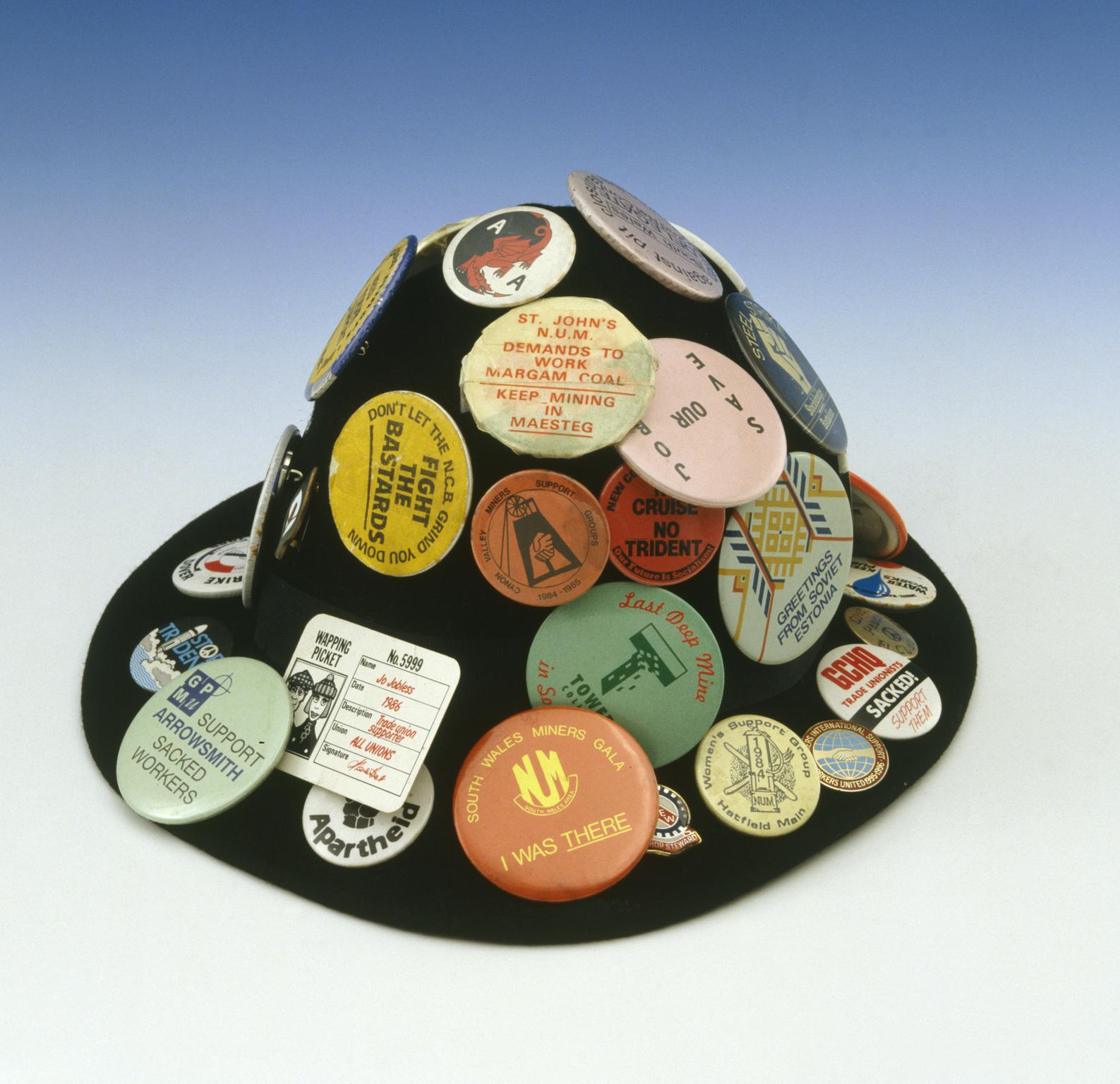 Felt hat with badges attached