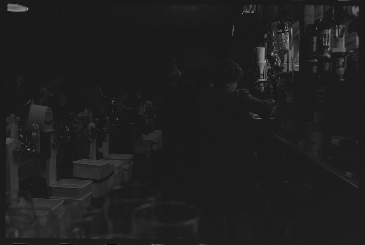 Staff behind bar at the Dowlais, Butetown.