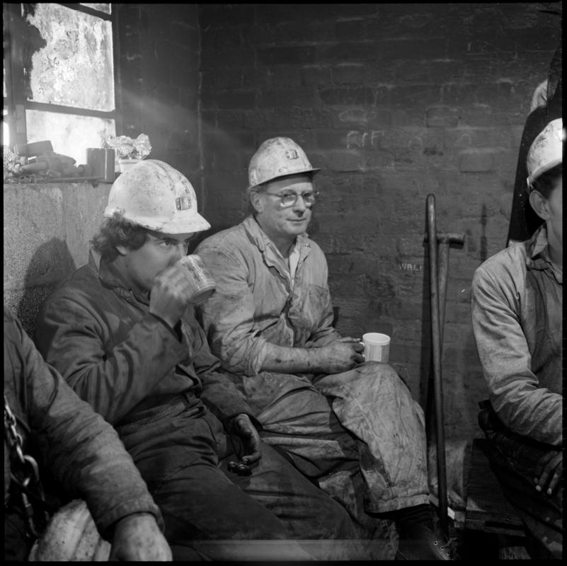 Black and white film negative of a photograph showing Celynen South Colliery workers on break, 6 November 1985.  &#039;South Celynen 6 Nov 1985&#039; is transcribed from original negative bag.