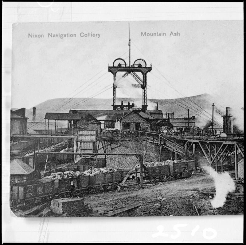 Black and white film negative of a photograph showing a surface view of Nixon&#039;s Navigation Colliery. &#039;Nixons Nav Mountain Ash&#039; is transcribed from original negative bag.