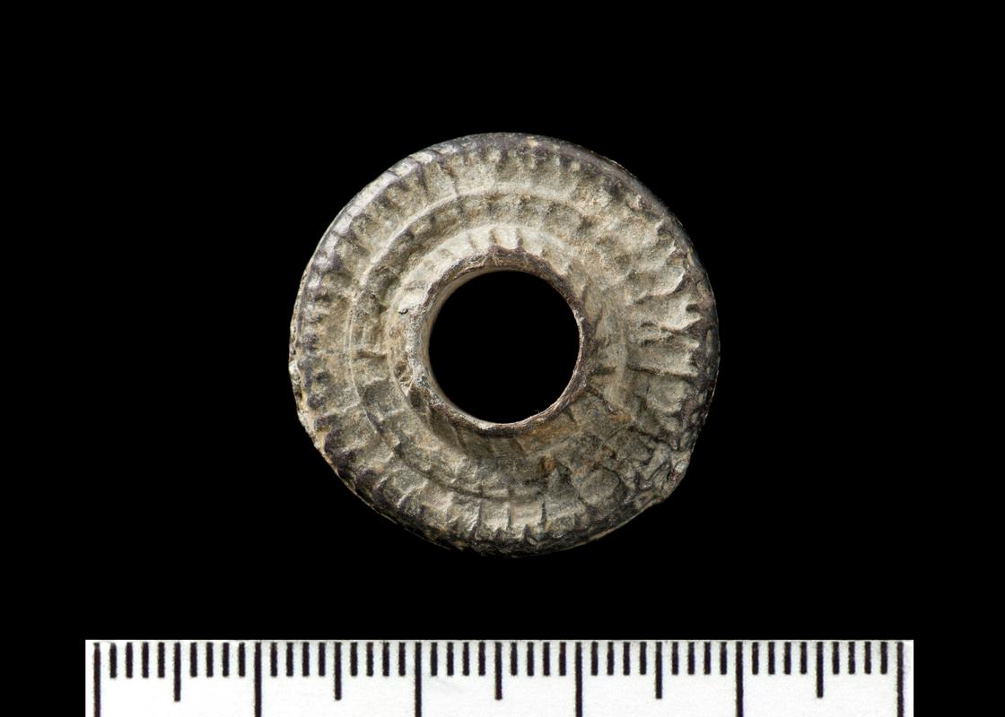 Medieval lead spindle whorl