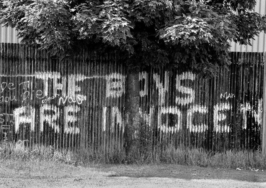 GB. WALES. Cardiff. Butetown - once know as &#039;Tiger Bay&#039;. Graffiti supporting the Cardiff Three, wrongfully convicted of the murder of Lynette White. 2003