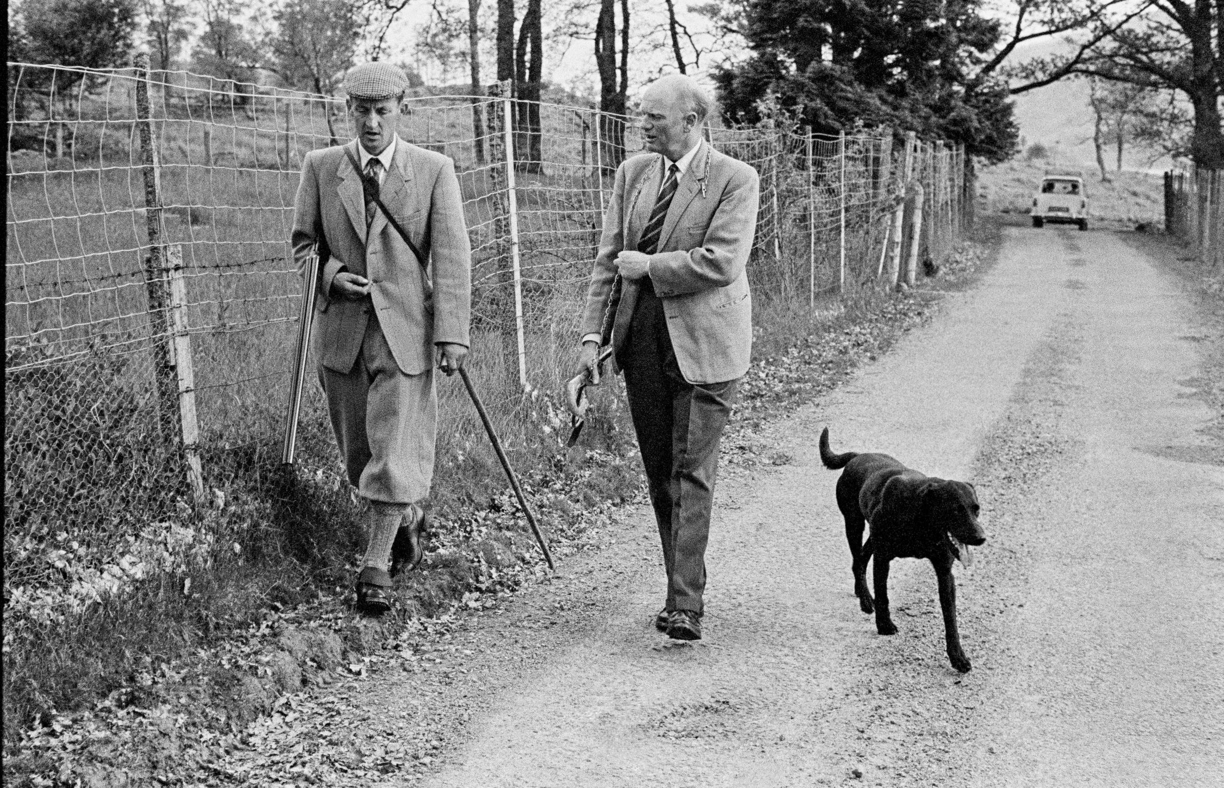 The head of the Clan Cameron of Locheal walks around his estate with his Head Gamekeeper. Scotland