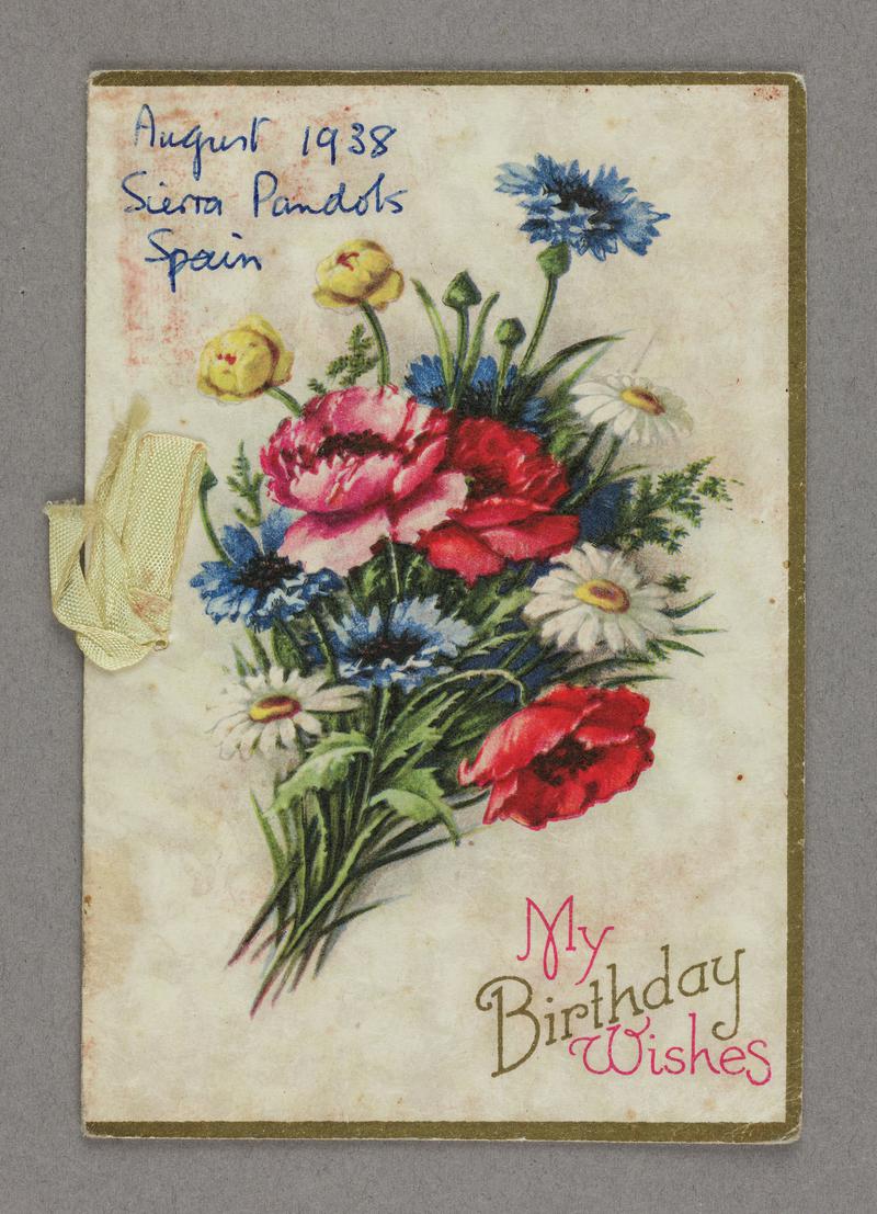 Birthday card sent to Edwin Greening in Spain from his mother 26/7/1938. Picture of flowers on front. Held together with yellow ribbon. Front