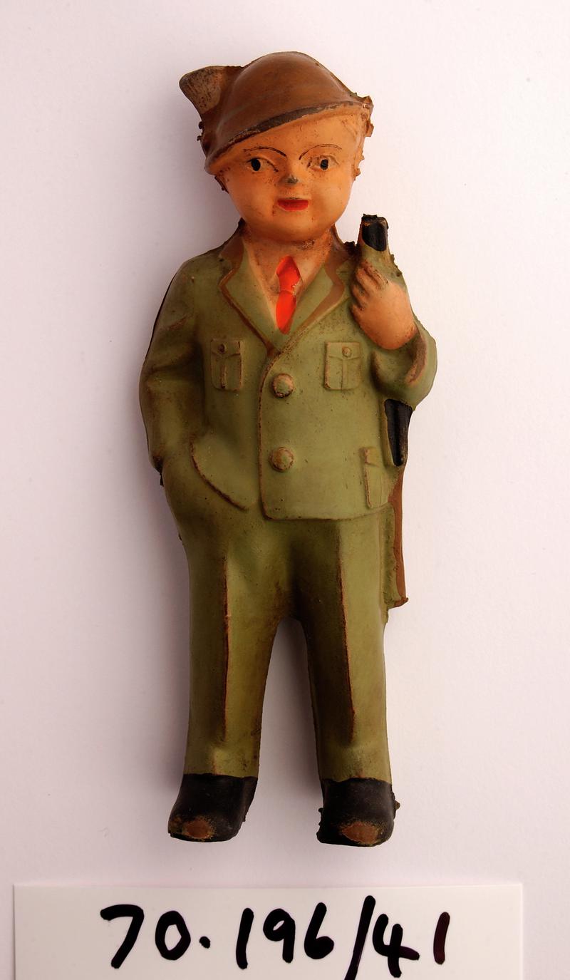 rubber doll in military uniform