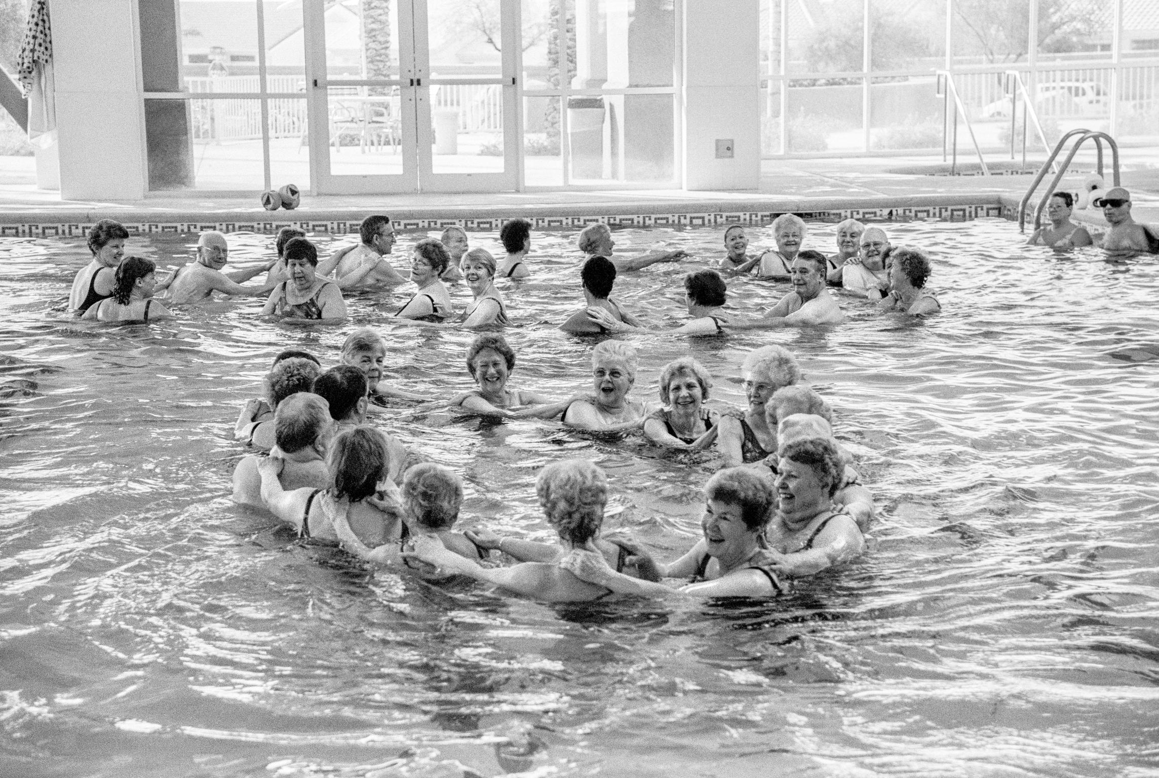 Early morning water pool exercise class for the senior citizens. Sun City,  Arizona USA