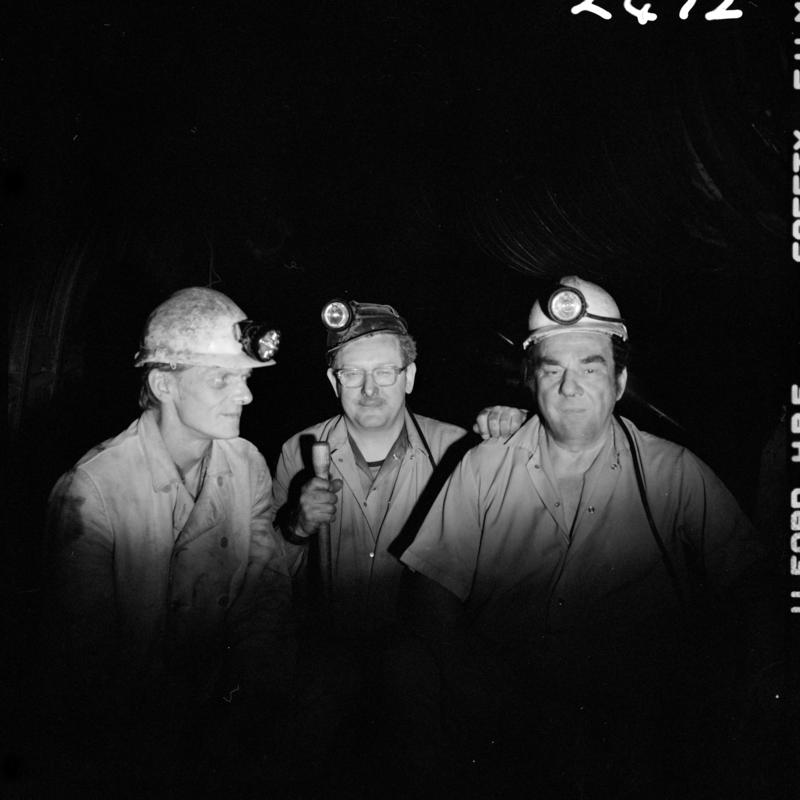Black and white film negative showing three miners, Merthyr Vale Colliery, 2 July 1981.  &#039;Merthyr Vale 2 Jul 1981&#039; is transcribed from original negative bag.
