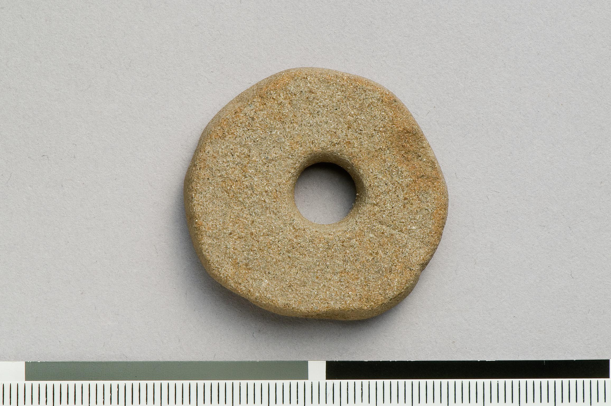 Roman stone spindle whorl