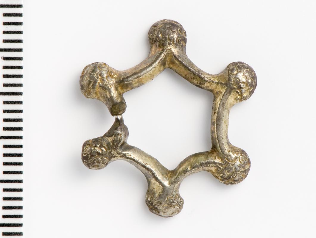 silver annular brooch