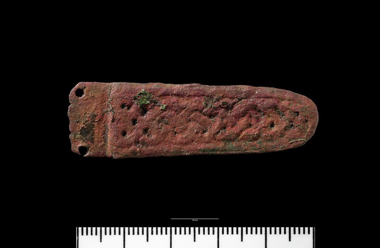Early medieval copper alloy strap end