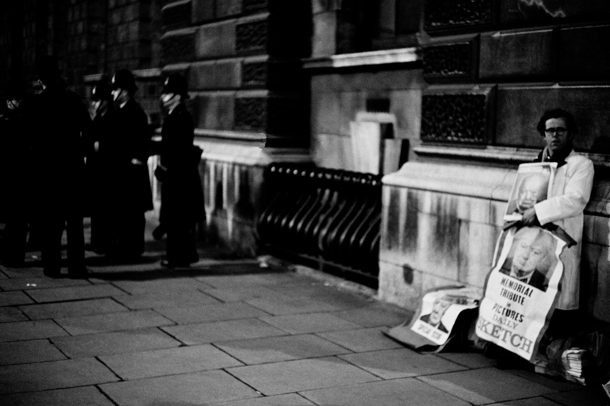 Winston Churchill funeral. Early morning. Newspaper seller. London, UK