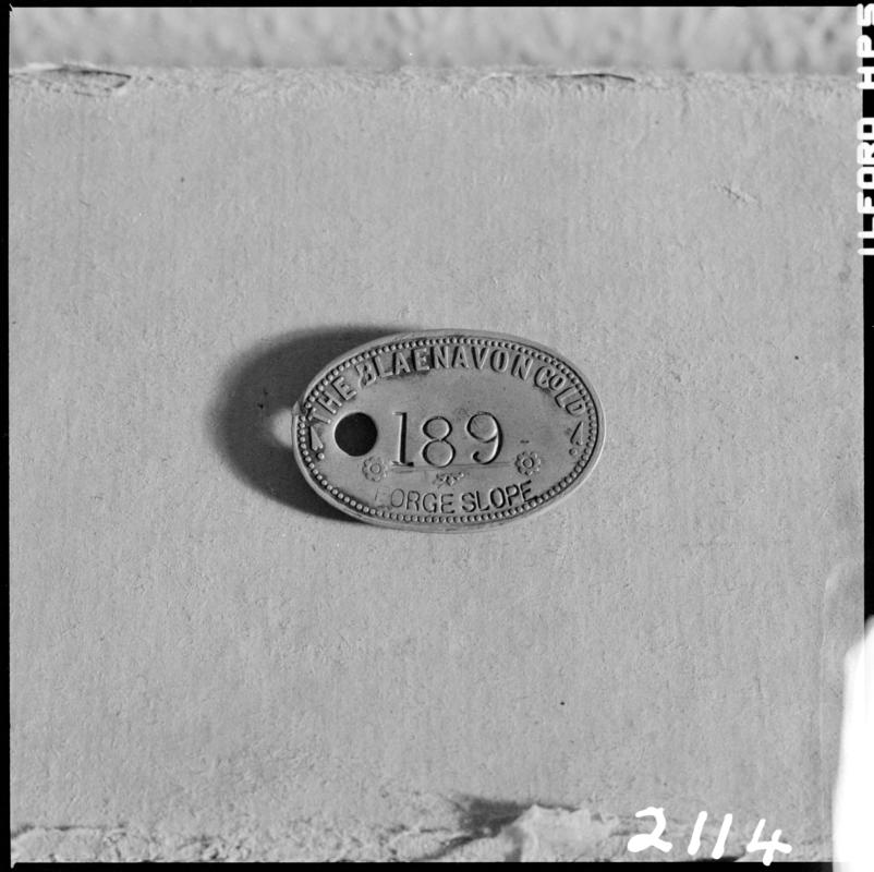 Black and white film negative showing a Blaenavon Co. Ltd. Forge Slope lamp check, no.189.  &#039;Blaenavon check&#039; is transcribed from original negative bag.