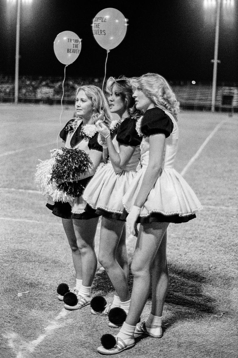 USA. ARIZONA. Tempe. Marcos de Niza High School Football game cheerleaders. 1979.