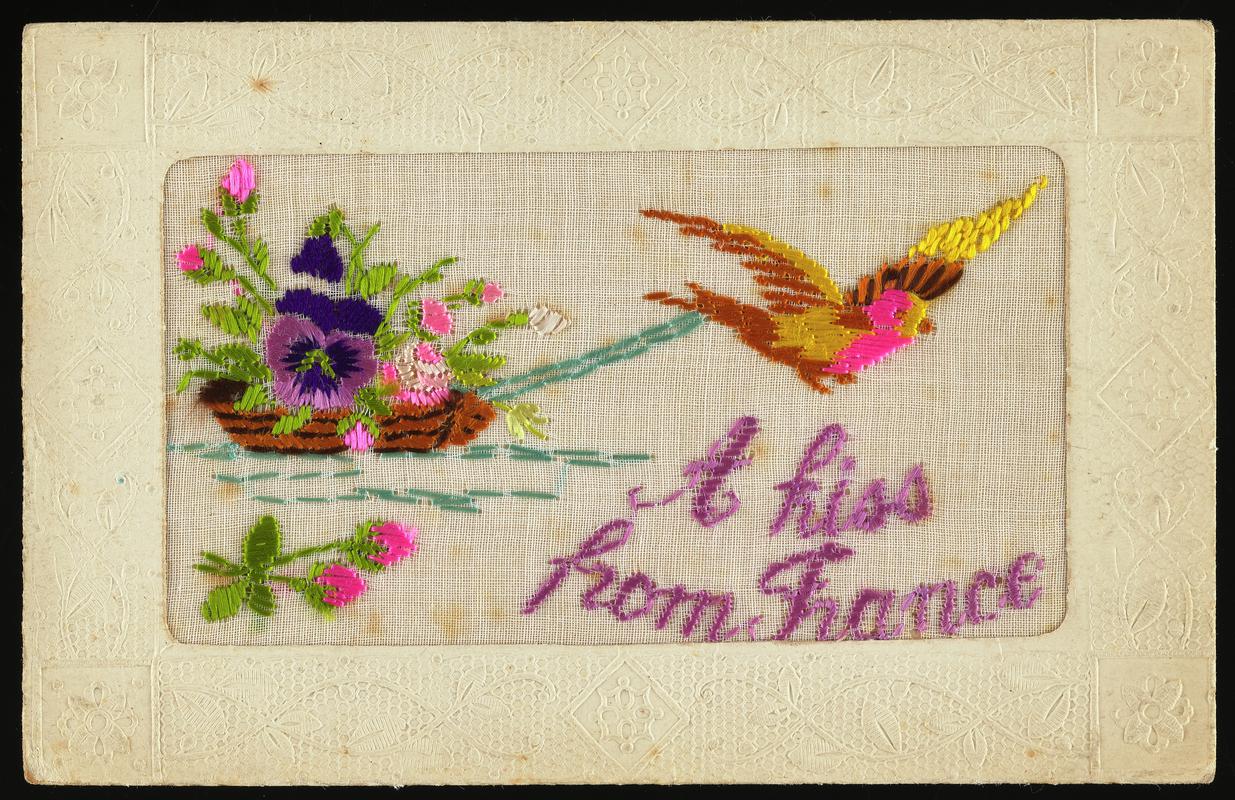 Embroidered postcard inscribed &#039;A kiss from France&#039;. Handwritten message on back. Dated 18 September 1917. Sent to Miss Evelyn Hussey, sister of Corporal Hector Hussey of the Royal Welch Fusiliers, during the First World War.