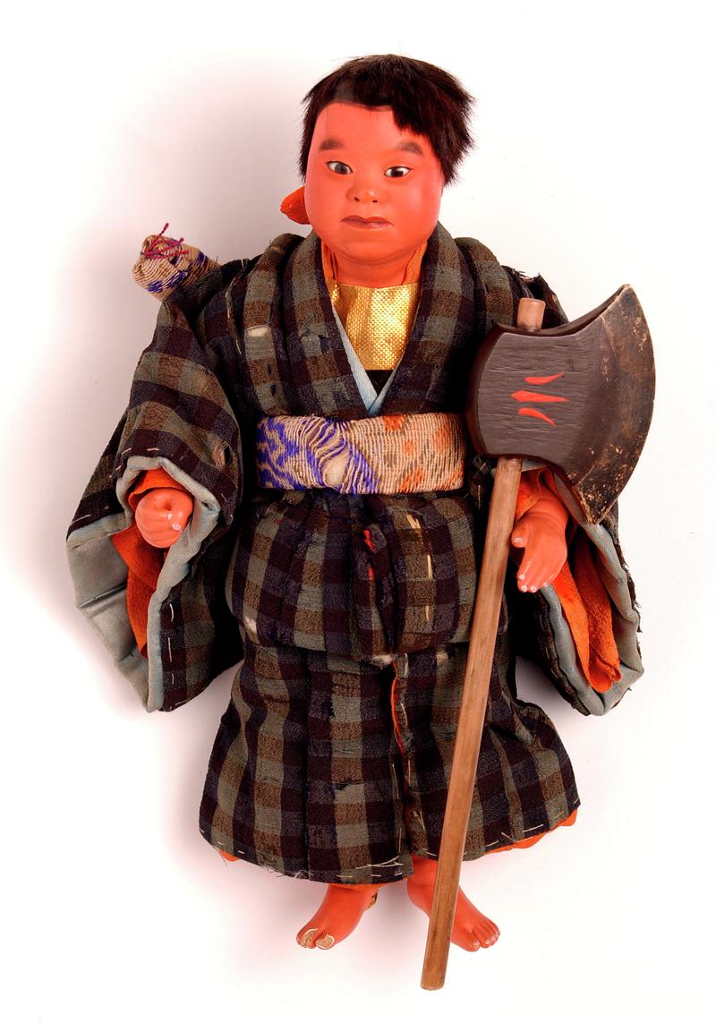 &#039;Yamata&#039; ningyo Japanese doll dressed as a samurai or warrior.  &#039;Cotton wool torso encased in paper; head and upper torso, forearms and lower legs composed of a composition including kiri-wood sawdust and wheat starch; coated over with gofum and painted