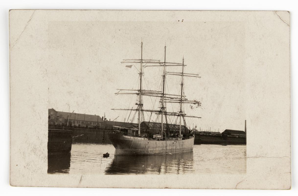 Unidentified 3-masted sailing ship in unidentified dock.