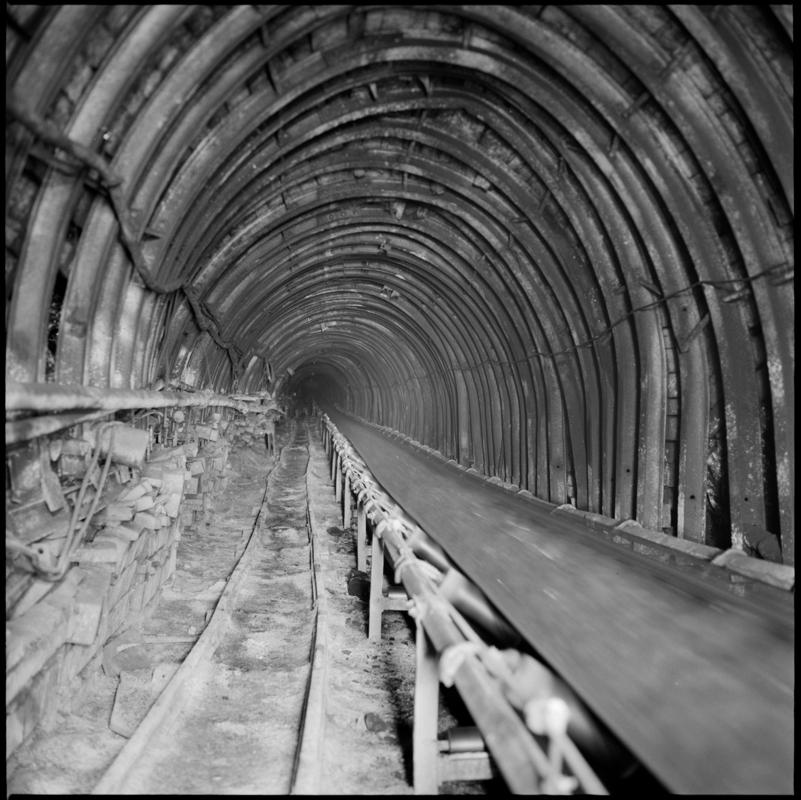 Colour film negative showing a high speed conveyor underground at Cwm Colliery.  &#039;Cwm&#039; is transcribed from original negative bag.