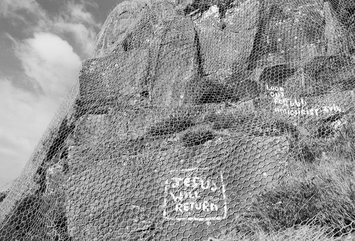 GB. WALES. Treherbert. Primitive sculptures made by a local council worker who&#039;s job was to look after the cliff face on the road above the town. 1993.