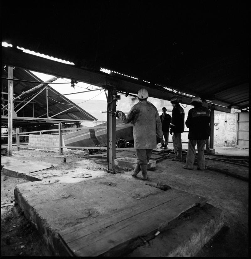 Black and white film negative showing men at the tub circuit, Coegnant Colliery 25 November 1981.  &#039;25 Nov 1981&#039; is transcribed from original negative bag.